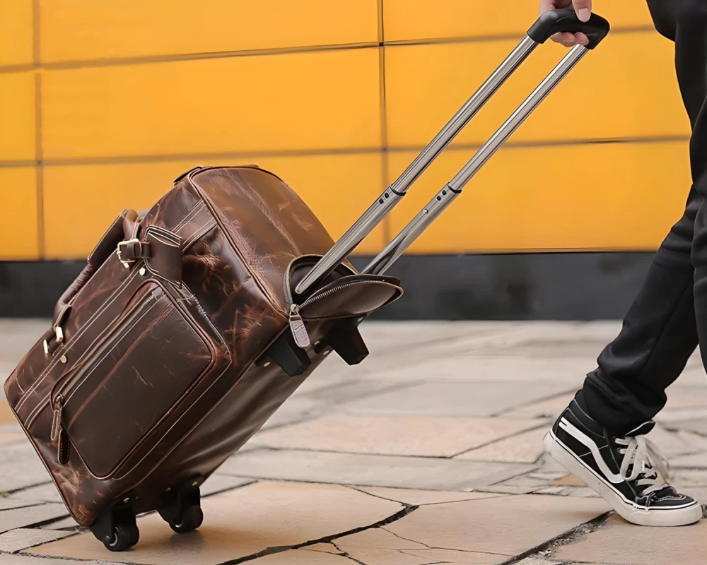 brown leather carry on bag